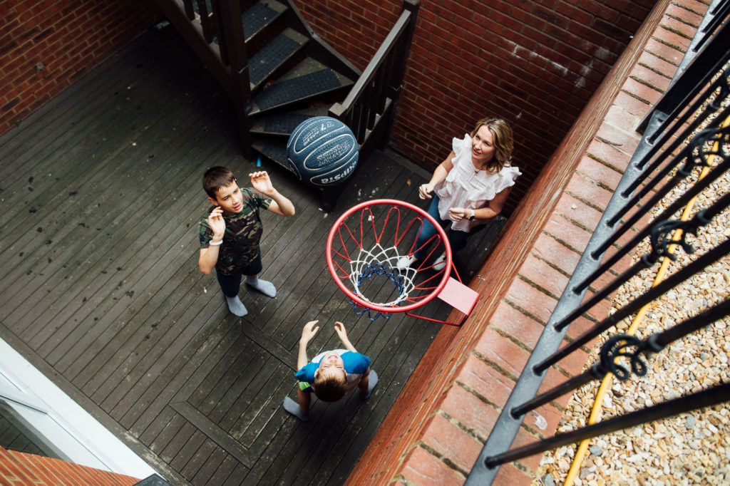 Family playing basketball documentary photographer Harpenden