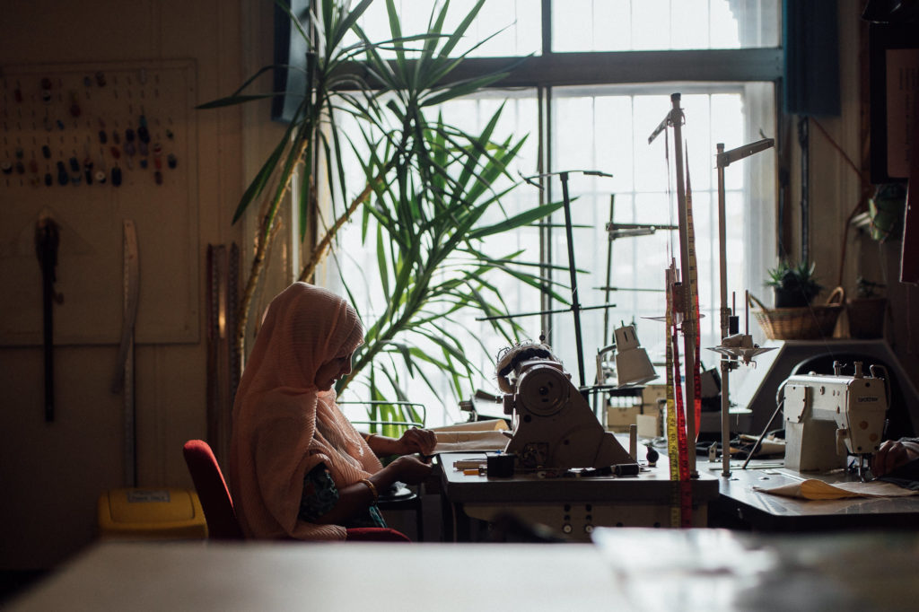 Portrait of Asian muslim woman sewing for Aerende ethical homeware by Emma Collins