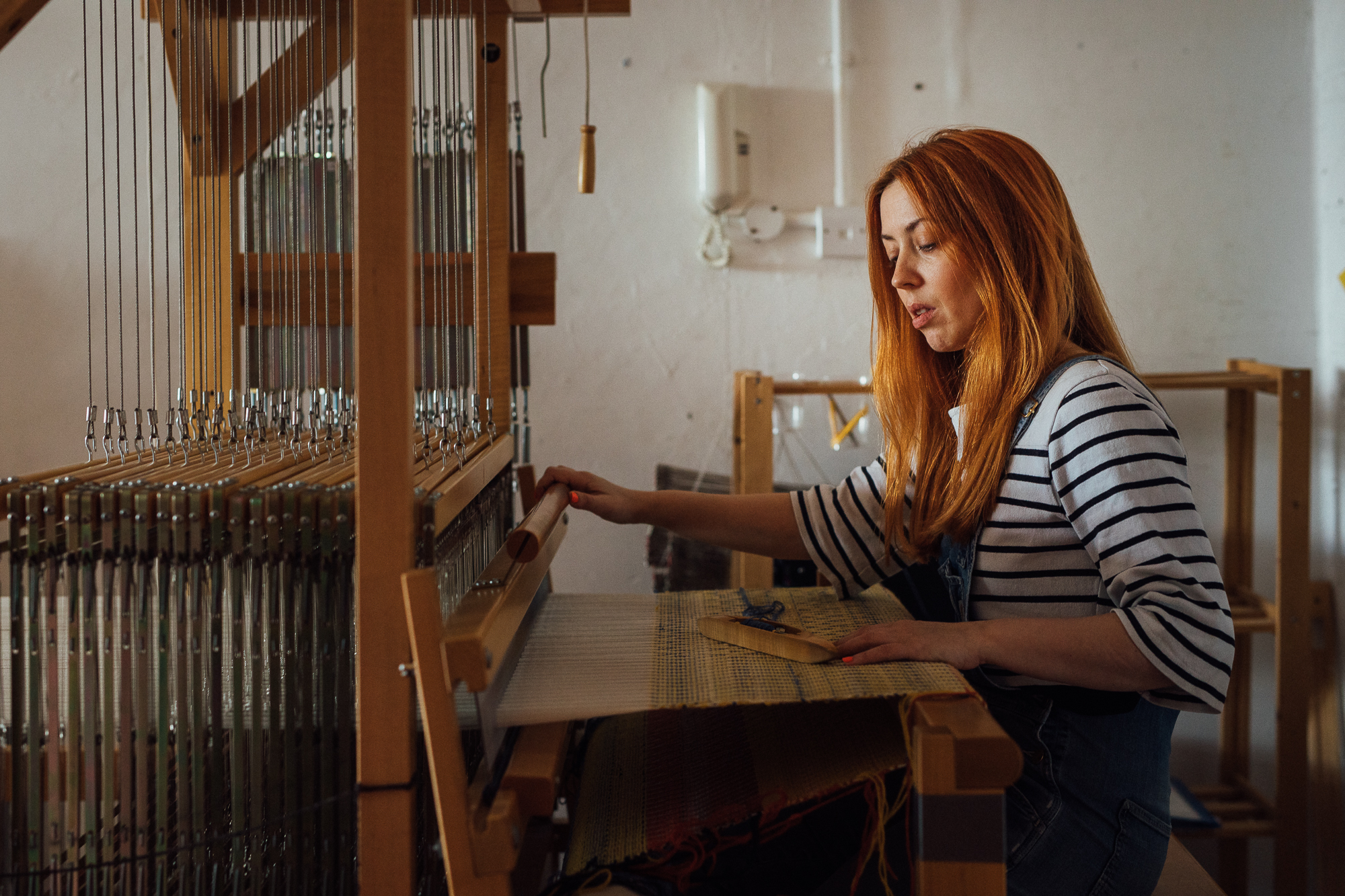 Brand environmental portrait of artisan weaver by Emma Collins