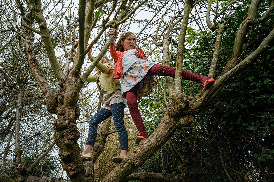 Girls tree climbing documentary child photography with Emma Collins