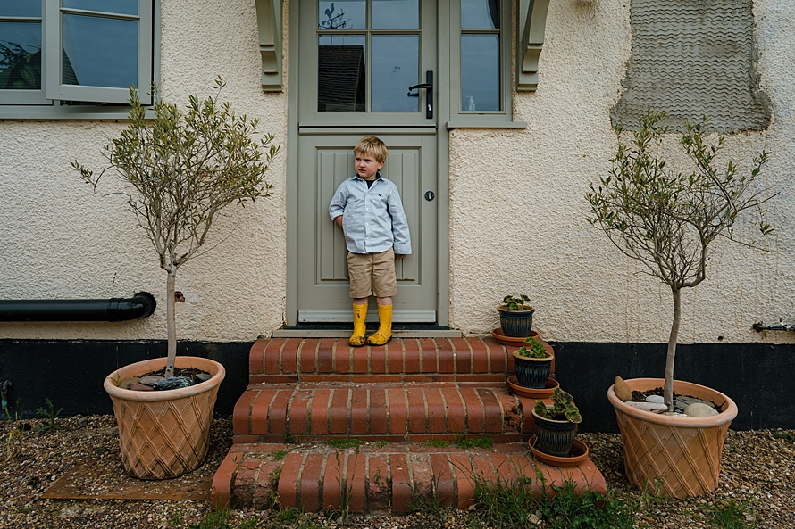 Boy at front door Family portrait photographer Harpenden
