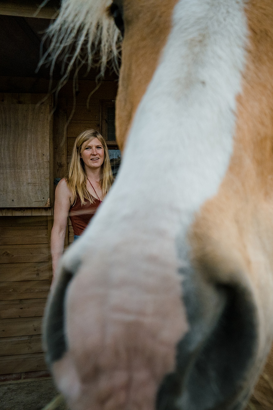 Unconventional portrait of woman with a horse in Harpenden