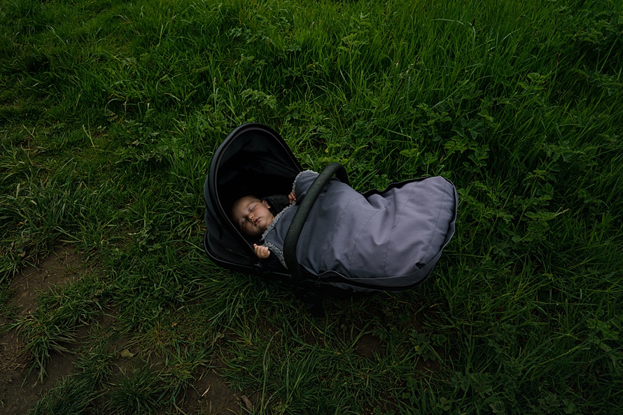 Unconventional portrait of baby in pram Harpenden family photographer