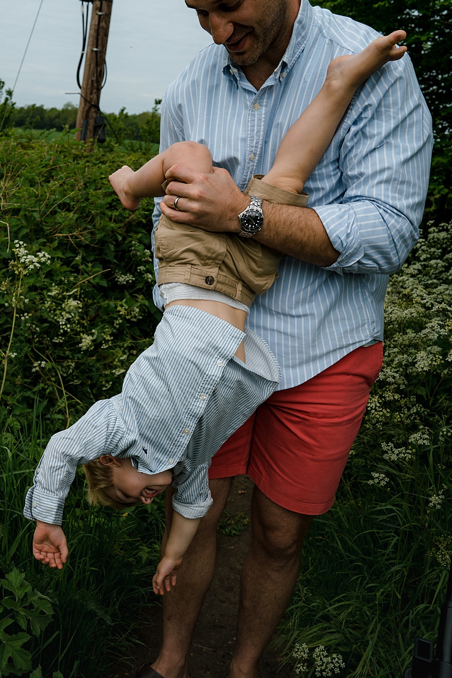 Dad playing with kids relaxed family photography London