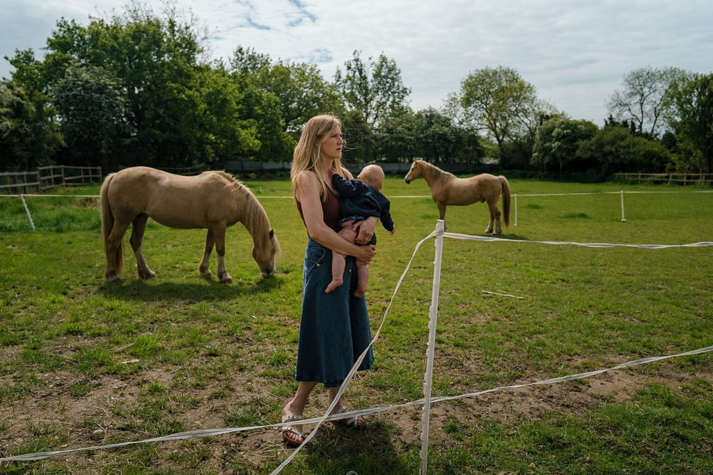 Family with horses, natural family photography in Harpenden